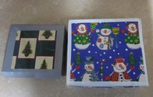 Boxes wrapped in Christmas paper and edged with duct tape.