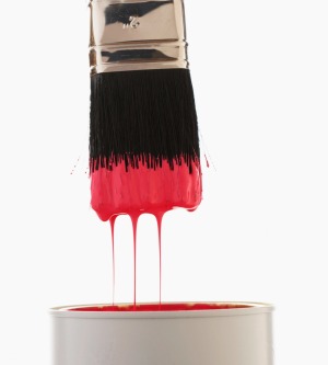 Paint can with red paint.