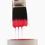 Paint can with red paint.