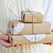 Presents wrapped in paper with doilies as accents.