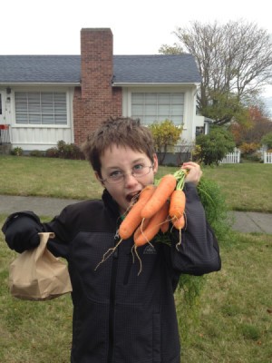 child with fresh carrots
