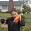 child with fresh carrots