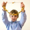Boy holding up a Pasta Necklace