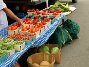 Selling vegetables at a farmers market.