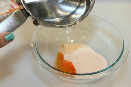 adding hot water to jello