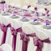 Photo of a wedding reception decorated in purple.