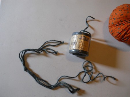 Tying knot in 4 lengths of jute.