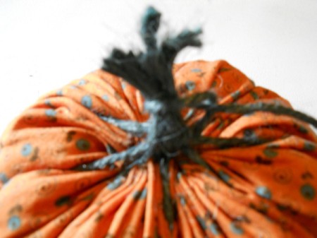 Tying off jute ends to make stem.