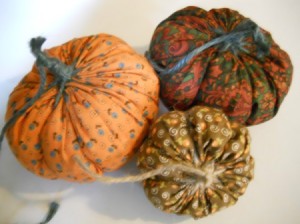 Three yo yo pumpkins.