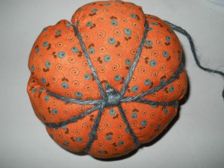 View of knot on bottom of pumpkin and jute used to make ridges.