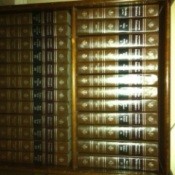 Encyclopedias on bookshelf.