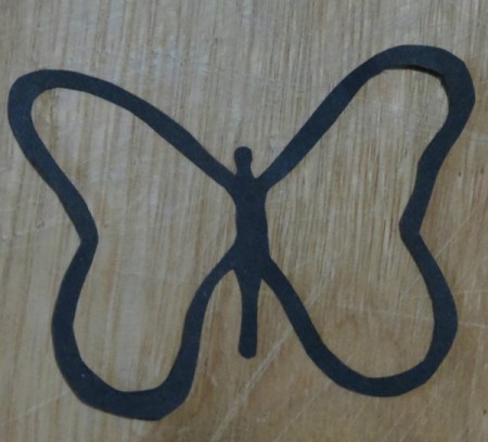 Black outline of butterfly.