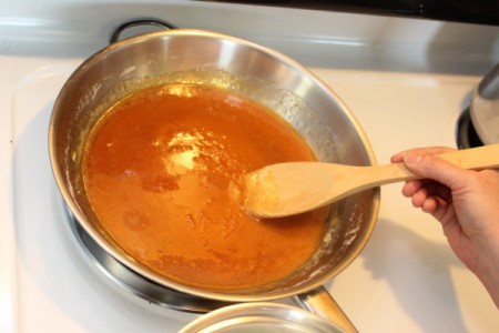 Stirring and browning sugar for caramel.