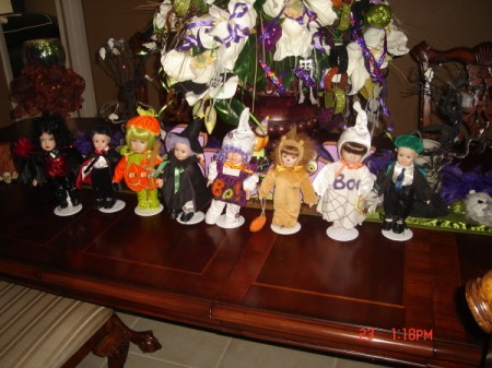Small dolls in Halloween costumes.