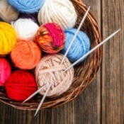 Knitting yarn and needles.