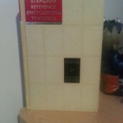 White bound encyclopedia volume.