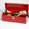 A red toolbox with tools.
