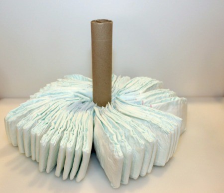 arrange diapers around tube