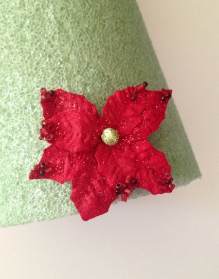 Adding the first poinsettia.