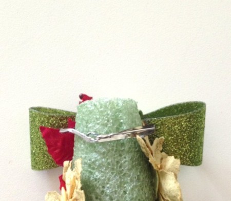 Attaching bow to top of tree.