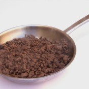 A frying pan of browned ground beef.