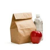 A bagged lunch, bottle of water and a red apple.