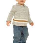 A toddler wearing jeans and a sweater.