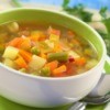 A bowl of fresh vegetable soup.