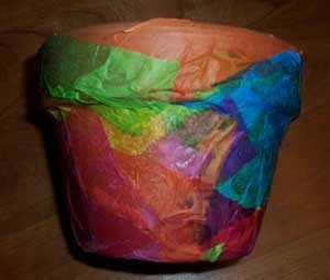 Clay flower pot covered with tissue paper.