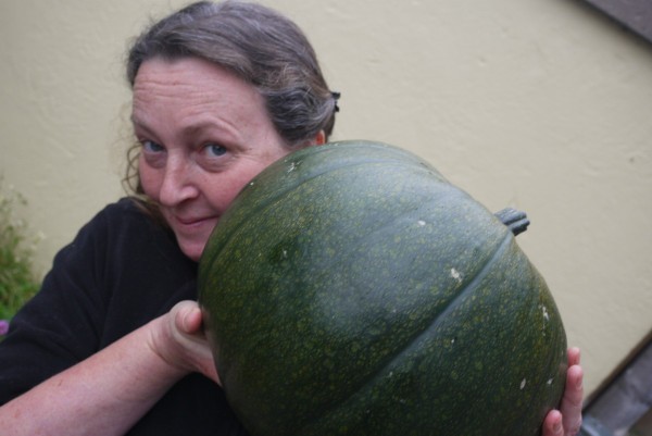 a woman holding a gourd