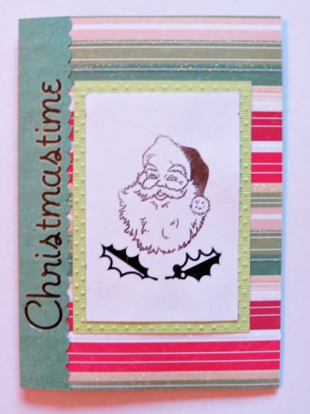 Adding stamped Santa and holly leaves.
