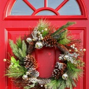 A Christmas wreath on a red door.