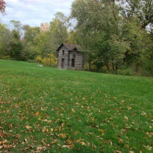 Lawn with old building.