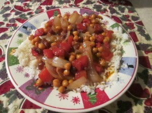 Serving of chickpea curry over rice.