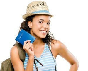 A young woman holding a passport.
