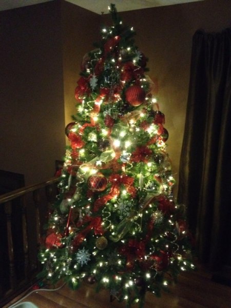 Tree with brighter lights in center section.