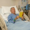 Man in Hospital With Get Well Card