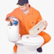 Man Repairing a Toilet