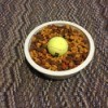 Tennis ball in dog food dish.