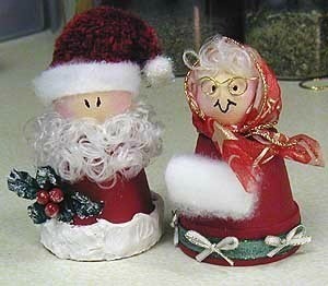 Santa and Mrs. Claus made from clay flower pots.