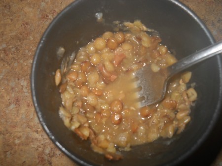 Mashing the lentils.