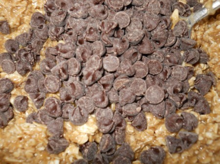 Adding chocolate chips and walnuts.