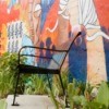Chair in Front of Public Mural