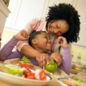 Mom Making Healthy Meal for Daughter