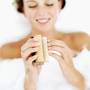 Woman Cleaning Fingernails