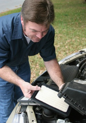 Man Troubleshooting a Truck That Won't Start