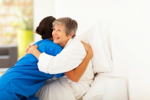 Woman Hugging Caregiver