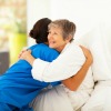 Woman Hugging Caregiver