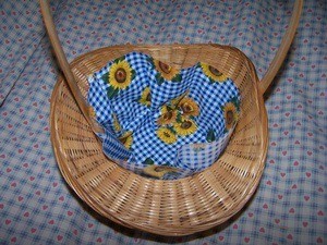 Placing fabric into basket.