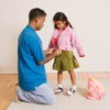 Dad Helping His Daughter get Ready for School